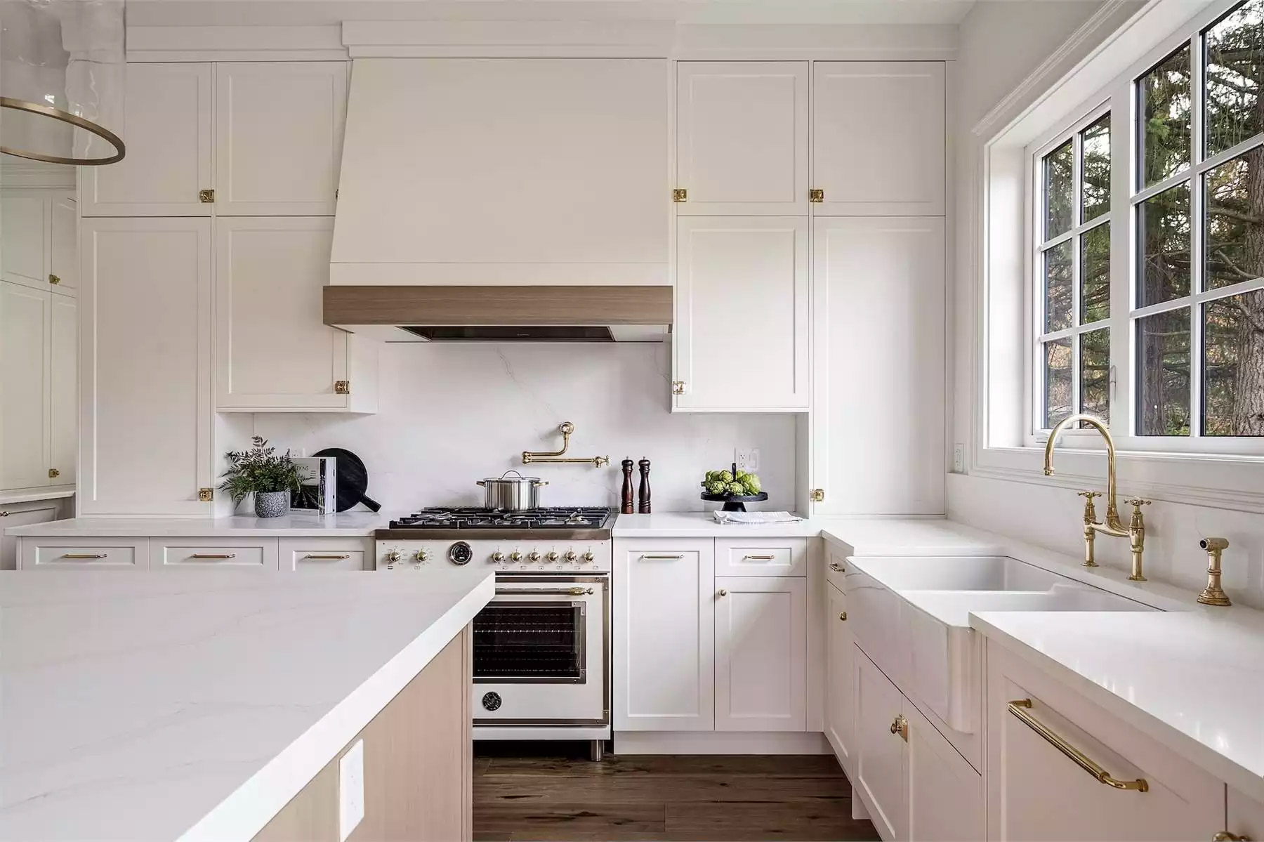 Luxury kitchen remodel in Montreal showcasing natural materials and warm lighting